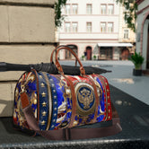 Luxury Americana Weekender Bag, Red Blue Gold Travel Bag, Brown Leather Straps, Spacious Carry-On Luggage, Patriotic Star Pattern Duffel with Royal Emblem | D20155